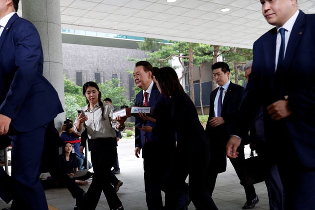 South Korea's former President Yoon Suk Yeol arrives at Seoul High Prosecutor's Office to attend questioning after being summoned as part of a probe by a special prosecutor into his botched attempt to declare martial law, in Seoul, South Korea, June 28, 2025. REUTERS/Kim Soo-hyeon