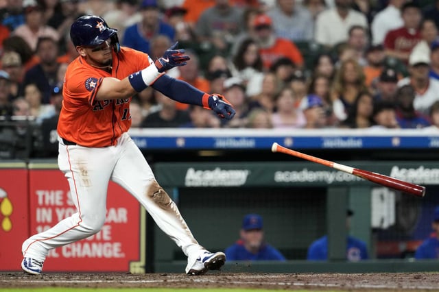 Houston Astros Isaac Paredes (15) loses his bat as he swings during the second inning of an MLB baseball game in Houston, Friday, June 27, 2025.