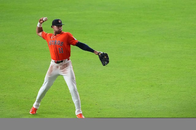 Houston Astros right fielder Cam Smith (11) throws to fans before the start of the seventh inning of an MLB baseball game in Houston, Friday, June 27, 2025.
