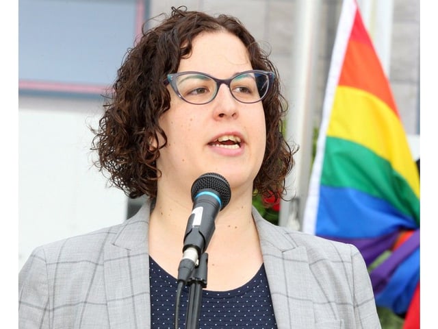 Skipping Stone founder Amelia Newbert speaks at City Hall during a flag raising event to kick off Pride Week in August 2019.