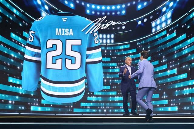 NHL commissioner Gary Bettman greets Michael Misa as the San Jose Sharks’ number two overall pick during the first round of the 2025 Upper Deck NHL Draft at the Peacock Theater on June 27, 2025 in Los Angeles, California. (Photo by Bruce Bennett/Getty Images)