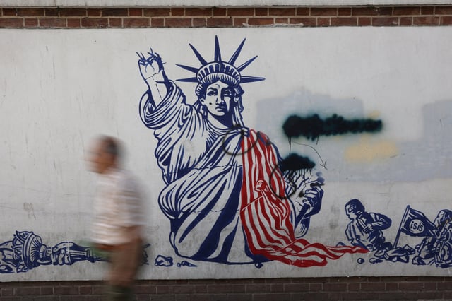 A man walks past an anti-US mural on a street in Tehran, Iran, June 5, 2025. Majid Asgaripour/WANA (West Asia News Agency) via REUTERS   ATTENTION EDITORS - THIS PICTURE WAS PROVIDED BY A THIRD PARTY