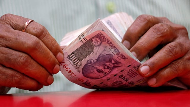  ₹9.35 Lakhs were found in his vehicle in the surprise check.