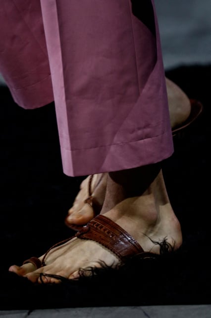 A model presents a creation from Prada Spring-Summer 2026 menswear collection during the Milan Fashion Week in Milan, Italy, June 22, 2025. REUTERS/Alessandro Garofalo/File Photo