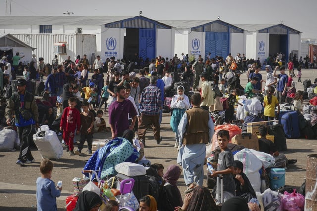 Afghan refugees who returned after fleeing Iran to escape deportation and conflict gather at a UNHCR facility near the Islam Qala crossing in western Herat province, Afghanistan, on Friday, June 20, 2025. (AP Photo/Omid Haqjoo)
