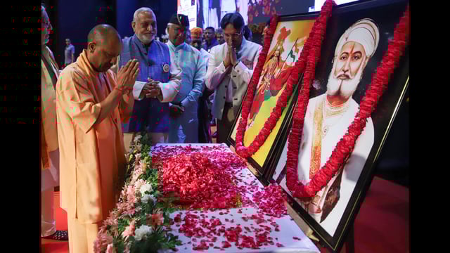 Chief minister Yogi Adityanath pays homage to Bharat Mata during an event organised on the eve of the birth anniversary of the great son of Mother India, the philanthropist Bhamashah, in Lucknow on Saturday. (ANI)