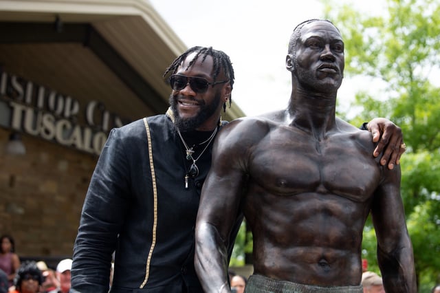 May 25, 2022; Tuscaloosa, AL, USA; Tuscaloosa Tourism and Sports unveiled a statute of former heavyweight boxing champion Deontay Wilder outside their offices on Jack Warner Parkway Wednesday. The statue was created by Tuscaloosa-based artist, Caleb O’Connor. Wilder stands beside the statue for photos to be taken. Mandatory Credit: Gary Cosby Jr.-The Tuscaloosa News
