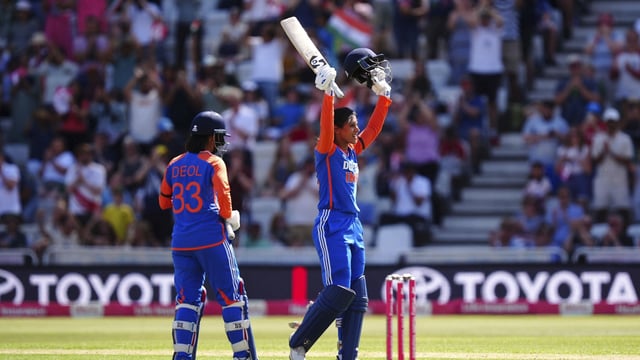 India's Smriti Mandhana celebrates her ton.