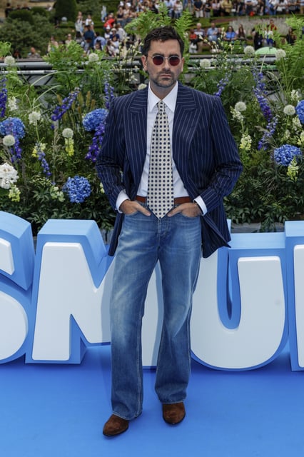 Dan Levy poses for photographers upon arrival at the world premiere of the film "Smurfs", on Saturday, June 28, 2025, in Brussels. (AP Photo/Omar Havana).