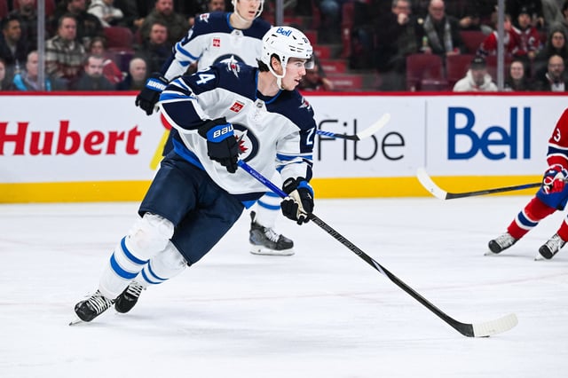 Jan 28, 2025; Montreal, Quebec, CAN; Winnipeg Jets defenseman Haydn Fleury (24) plays the puck against the Montreal Canadiens during the second period at Bell Centre. Mandatory Credit: David Kirouac-Imagn Images/File Photo