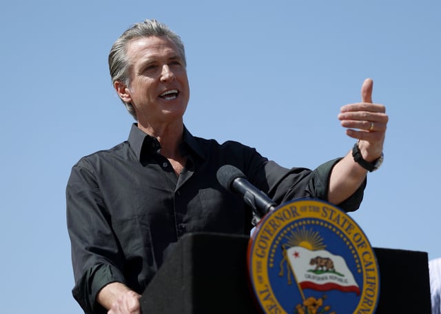 California Governor Gavin Newsom speaks during a news conference at Gemperle Orchard on April 16, 2025 in Ceres, California. Governor Gavin Newsom and California Attorney General Rob Bonta have filed a lawsuit in federal court challenging the Trump administration&#39;s use of emergency powers to enact sweeping tariffs that hurt states, consumers, and businesses.