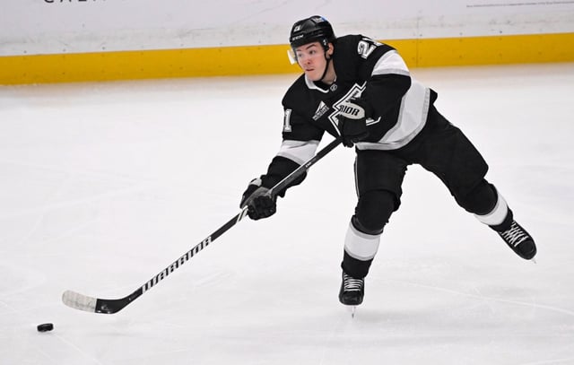 Jordan Spence of the Kings passes agent the Colorado Avalanche during the first period  at Crypto.com Arena on Saturday, April 12, 2025. (Photo by Keith Birmingham, Orange County Register/ SCNG)