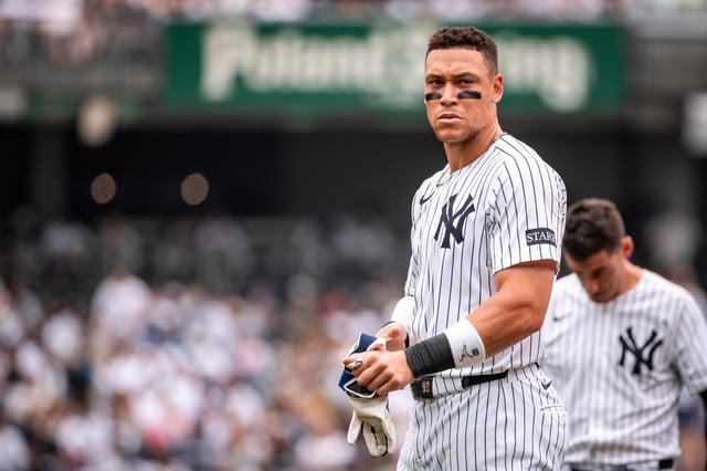 New York Yankees&#39; Aaron Judge (99) takes off his gloves after grounding into double play during the first inning of a baseball game against the Athletics, Saturday, June 28, 2025, in New York. (AP Photo/Angelina Katsanis)