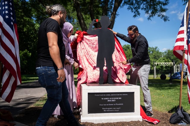 A monument in memory of Wadee Alfayoumi, the young boy who was brutally killed by his landlord because he was of Palestinian descent in 2023, is unveiled at Van Horn Woods East Playground on Saturday, June 28, 2025, in Plainfield. Alfayoumi frequented the playground growing up, his father said. (Audrey Richardson/Chicago Tribune)