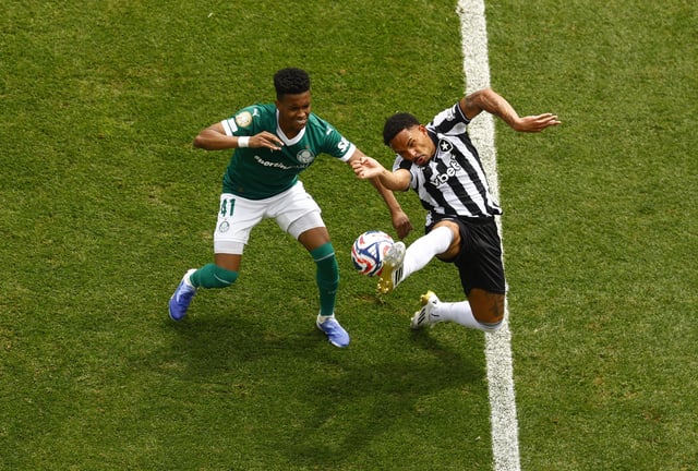 Soccer Football - FIFA Club World Cup - Round of 16 - Palmeiras v Botafogo - Lincoln Financial Field, Philadelphia, Pennsylvania, U.S. - June 28, 2025 Botafogo's Vitinho in action with Palmeiras' Estevao REUTERS/Susana Vera
