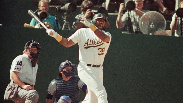 Oakland Athletics' Dave Parker (39) watches the ball fly over the right center field wall for a sixth inning solo home run in Game 2 of the American League Championship baseball series against the Toronto Blue Jays, at Oakland, Calif., Oct. 4, 1989.