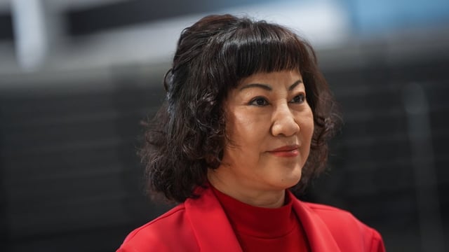 Billionaire Ruby Liu listens during an interview at a former Hudson's Bay-owned Saks Off 5th department store after a "handover ceremony" where she received the keys to the space at Tsawwassen Mills shopping mall that she owns, in Tsawwassen, B.C., on Thursday.