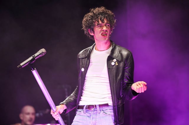 Matty Healy of The 1975 performs during the Glastonbury Festival in Worthy Farm, Somerset, England, Friday, June 27, 2025. (Scott A Garfitt/Invision/AP)