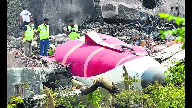 Forensic experts and DGCA officials searching for evidence at Air India Plane crash site. (HT PHOTO)