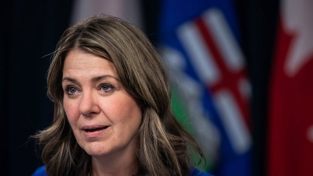 Alberta Premier Danielle Smith speaks to reporters on April 29. On her weekend radio program on Saturday, she said the province will fight the temporary court injunction against Bill 26.