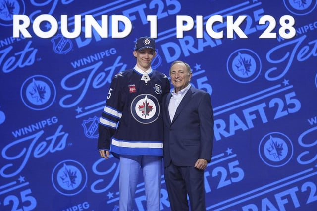 Sascha Boumedienne, left, stands with NHL commissioner Gary Bettman after being drafted by the Winnipeg Jets during the NHL hockey draft Friday, June 27, 2025, in Los Angeles. (AP Photo/Damian Dovarganes)