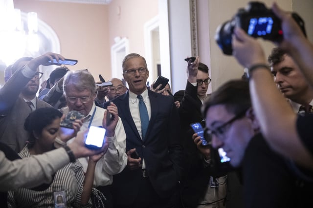 Senate Majority Leader John Thune (R-S.D.) speaks with reporters as he walks to his office at the U.S. Capitol June 27, 2025.
