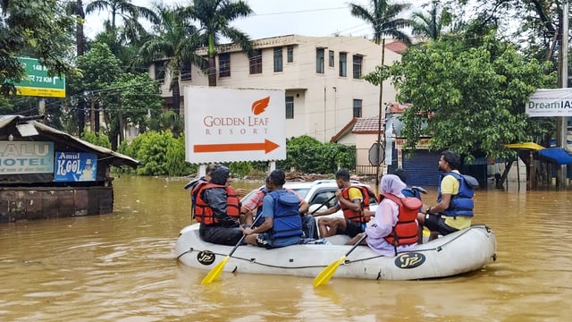 People being shifted to a safer place through a rescue boat amid waterlogging after heavy rainfall, at Jamshedpur, in East Singhbhum district.