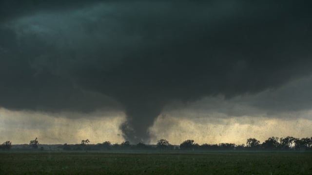 Multiple tornado reports emerged from severe storms in eastern South Dakota and western Minnesota, causing downed trees and power outages for over 50,000 customers.