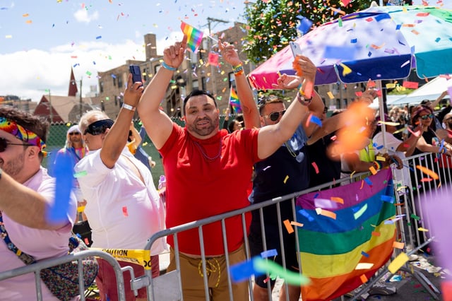 Parade spectators cheer as confetti falls from a parade float during the 53rd annual Chicago Pride Parade on June 30, 2024, in Chicago. (Vincent Alban/Chicago Tribune)