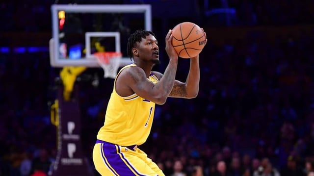 Mar 4, 2025; Los Angeles, California, USA;  Los Angeles Lakers forward Dorian Finney-Smith (17) shoots three point basket against the against the New Orleans Pelicans during the first half at Crypto.com Arena. Mandatory Credit: Gary A. Vasquez-Imagn Images