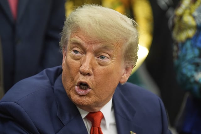 President Donald Trump answers questions from reporters as he meets with Congo&#39;s Foreign Minister Therese Kayikwamba Wagner, and Rwanda&#39;s Foreign Minister Olivier Nduhungirehe, Friday, June 27, 2025, in the Oval Office at the White House in Washington DC.
