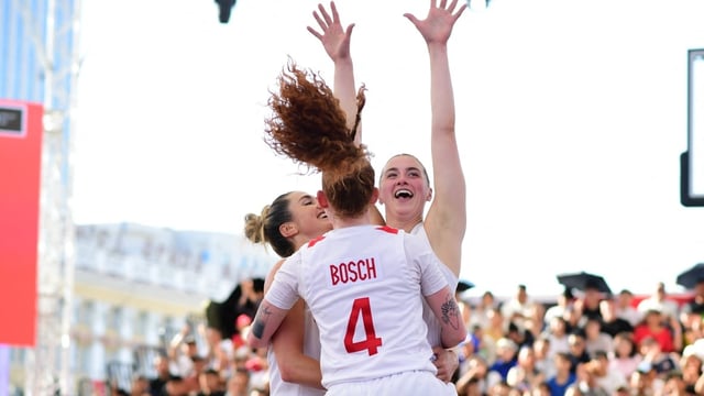Canada's Cassandra Brown, left, Kacie Bosch and Paige Crozon celebrate after defeating Spain in the quarterfinals of the FIBA women's 3x3 basketball World Cup on Saturday at Sükhbaatar Square in Ulaanbaatar, Mongolia.