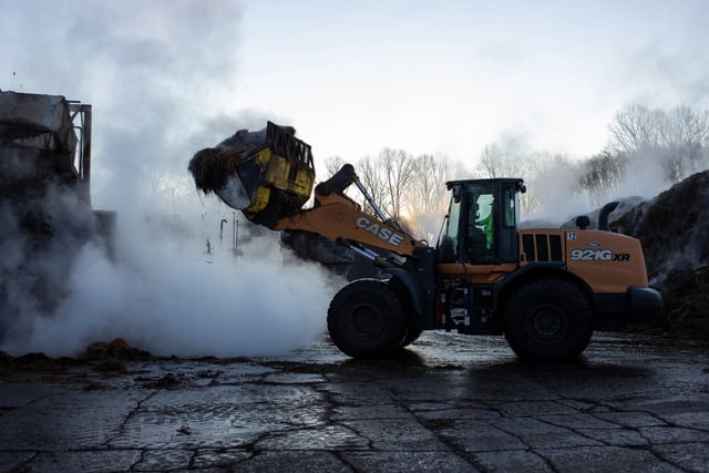 Farm workers prepare the compost for growing mushrooms in Avondale, Pa., on Mar. 3, 2025. Most employees arrive for work before sunrise around 4:00am.