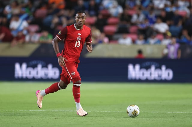 Derek Cornelius #13 of Canada advances the ball in the first half against El Salvador during the Group Stage - Group B match as part of the 2025 CONCACAF Gold Cup at Shell Energy Stadium on June 24, 2025 in Houston, Texas.