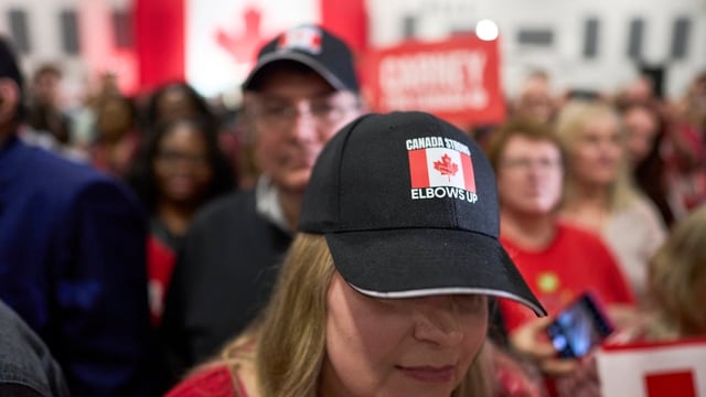 A supporter wears a hat reading, 'Canada Strong, Elbows Up,' at a campaign rally for Liberal Leader Mark Carney, before he became prime minister, in London, Ont., on April 25.