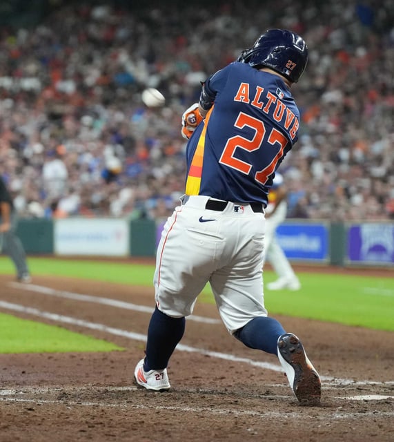 Houston Astros second base Jose Altuve (27) connects for a two-run home run in the bottom of the fifth inning against the Chicago Cubs at Daikin Park in Houston on Sunday, June 29, 2025.