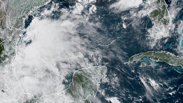 This satellite image provided by the National Oceanic and Atmospheric Administration (NOAA) shows Tropical Storm Barry