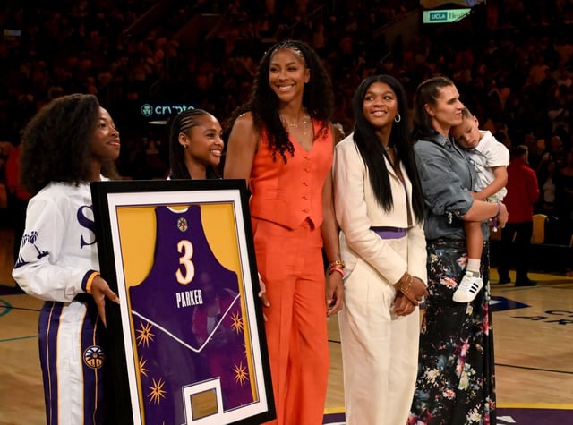 Candace Parker smiles as her jersey is retired during halftime of a WNBA basketball game between the Chicago Sky and the Los Angeles Sparks at Crypto.com Arena in Los Angeles on Sunday, June 29, 2025. (Libby Cline Birmingham, Contributing Photographer)