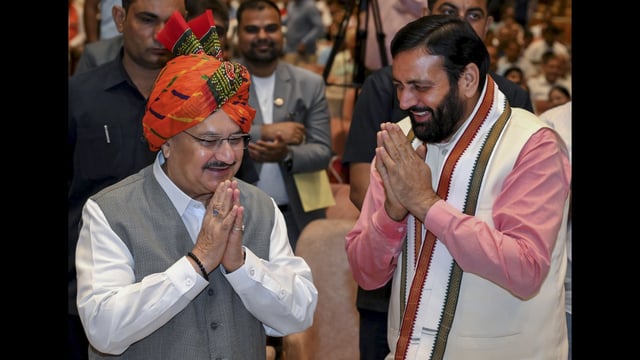 Union minister and BJP national president JP Nadda being greeted by Haryana chief minister Nayab Singh Saini during a ‘Mann Ki Baat’ programme in Gurugram on Sunday. (PTI)