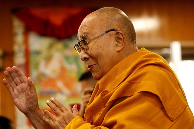 Tibetan spiritual leader, the Dalai Lama, offers blessings to his followers at his Himalayan residence in the northern hill town of Dharamshala, India, December 20, 2024. REUTERS/Priyanshu Singh/File Photo