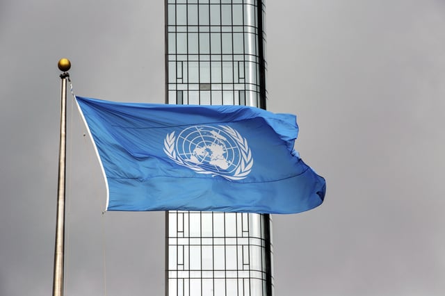 FILE - The United Nations flag flies on a stormy day at the U.N. during the United Nations General Assembly, Sept. 22, 2022. (AP Photo/Ted Shaffrey, File)