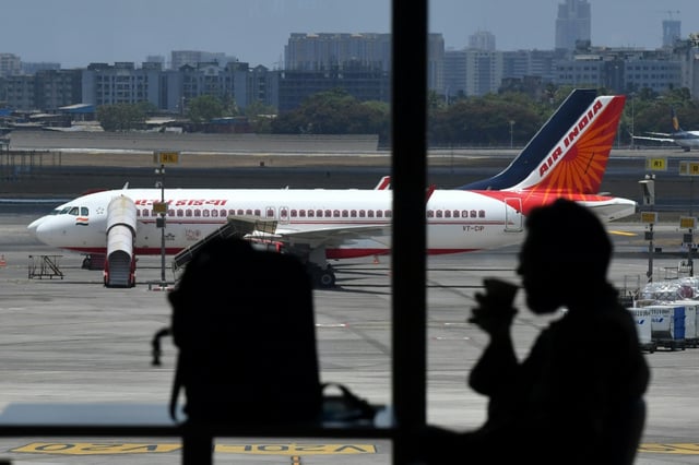 Indian customs officers in Mumbai said they have stopped a plane passenger arriving from Thailand with a wriggling cargo of live snakes, the third such seizure this month