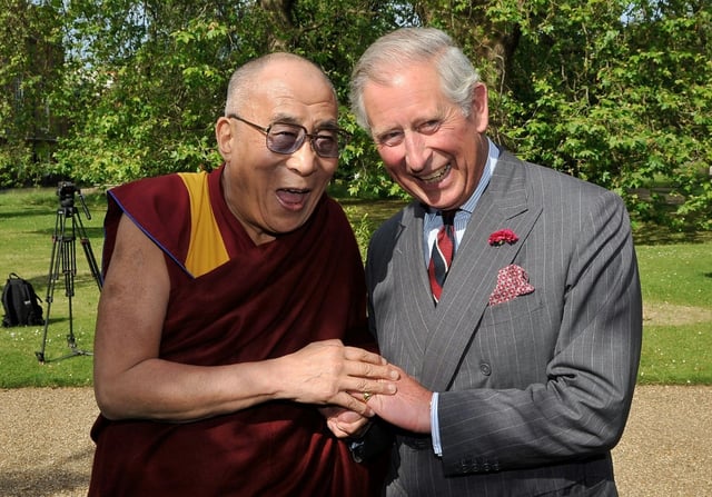 The Dalai Lama shares a laugh in 2012 with British royal Charles, who is now the country's monarch