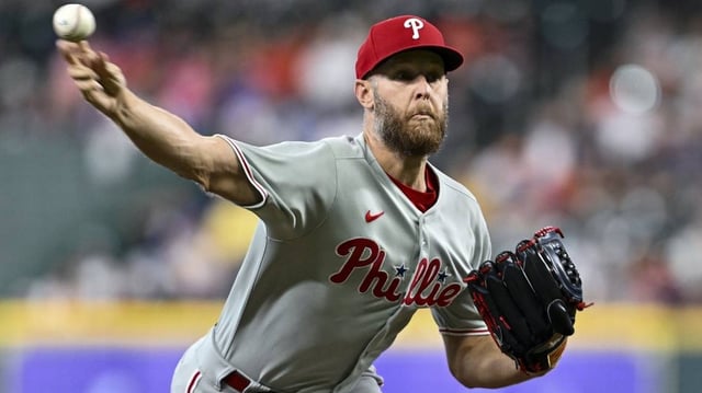 Jun 25, 2025; Houston, Texas, USA; Philadelphia Phillies starting pitcher Zack Wheeler (45) delivers a pitch against the Houston Astros in the first inning at Daikin Park. Mandatory Credit: Maria Lysaker-Imagn Images