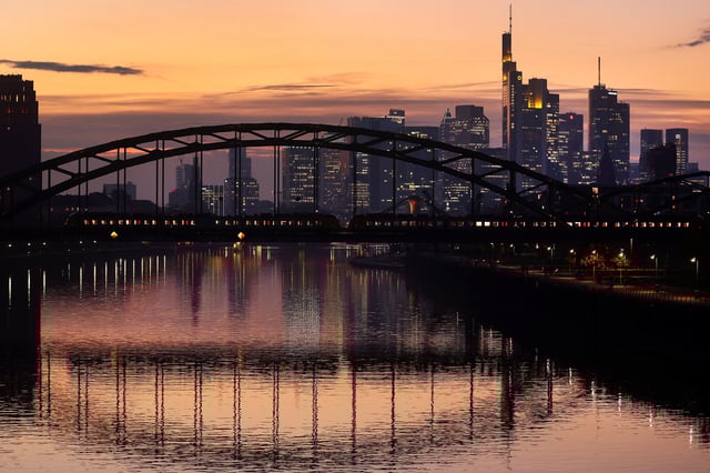 A commuter train passes by the skyline with its financial district in Frankfurt, Germany, October 25, 2021.  REUTERS/Kai Pfaffenbach/File Photo