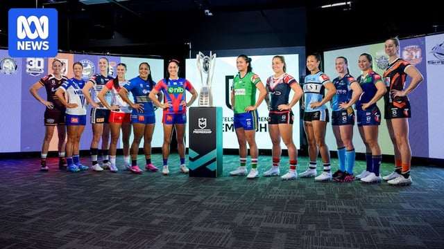 A group of rugby league captains assemble before a trophy 