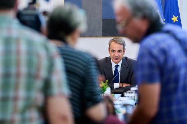 Greece's Prime Minister Kyriakos Mitsotakis addresses a ministerial cabinet meeting in Athens, Greece, Monday, June 30, 2025. (AP Photo/Petros Giannakouris)