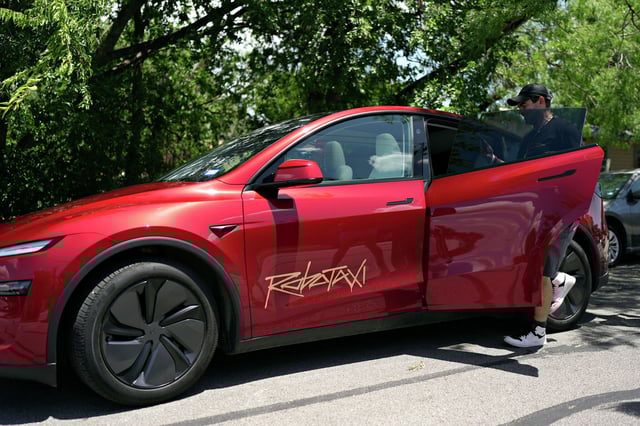 A rider boards a driverless Tesla robotaxi last week in Austin, Texas. Some believe Elon Musk’s robotaxis could come to California.