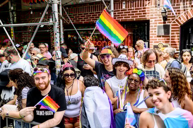 NEW YORK, NEW YORK - JUNE 29: Spectators in pride colors gather outside the Stonewall Inn during the 2025 New York City Pride March on June 29, 2025 in New York City. (Photo by Roy Rochlin/Getty Images)