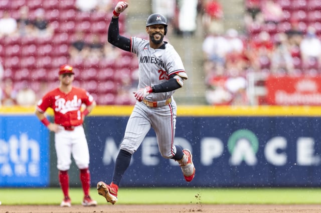 CINCINNATI, OHIO - JUNE 19: Byron Buxton #25 of the Minnesota Twins celebrates after hitting a solo home run in the first inning of the game against the Cincinnati Reds at Great American Ball Park on June 19, 2025 in Cincinnati, Ohio.